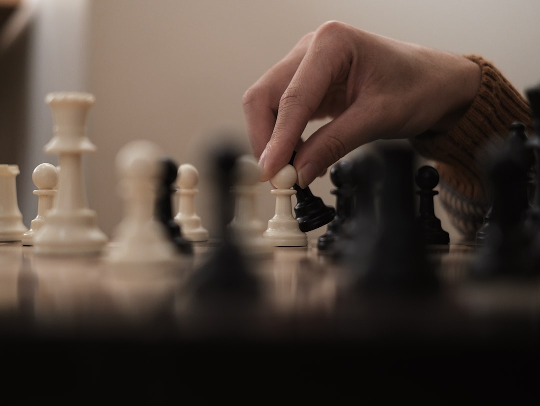 A person is playing a game of chess