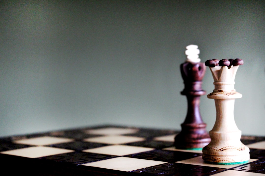 Queen and king chess pieces on board