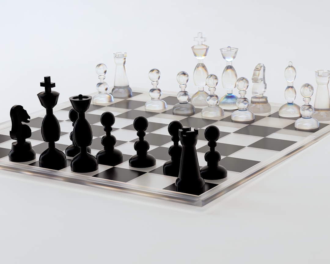 A glass chess board with black pieces on it