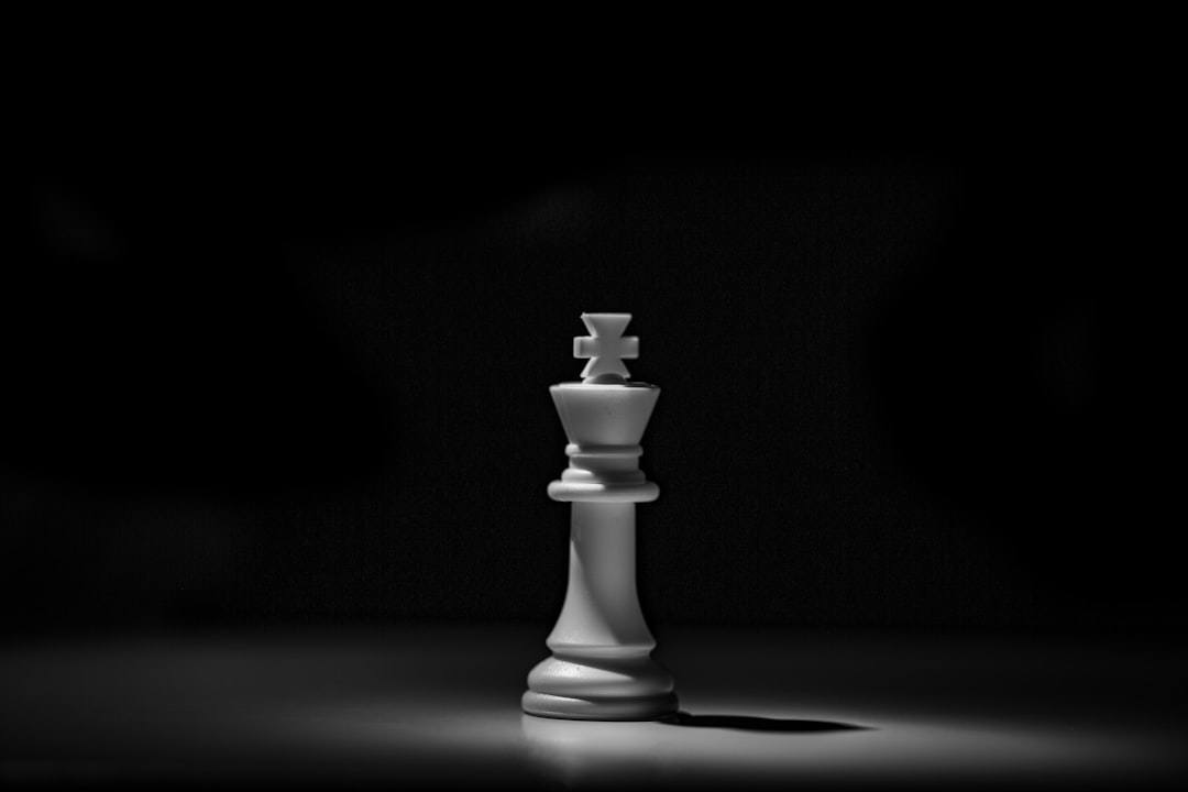 White chess piece on black table